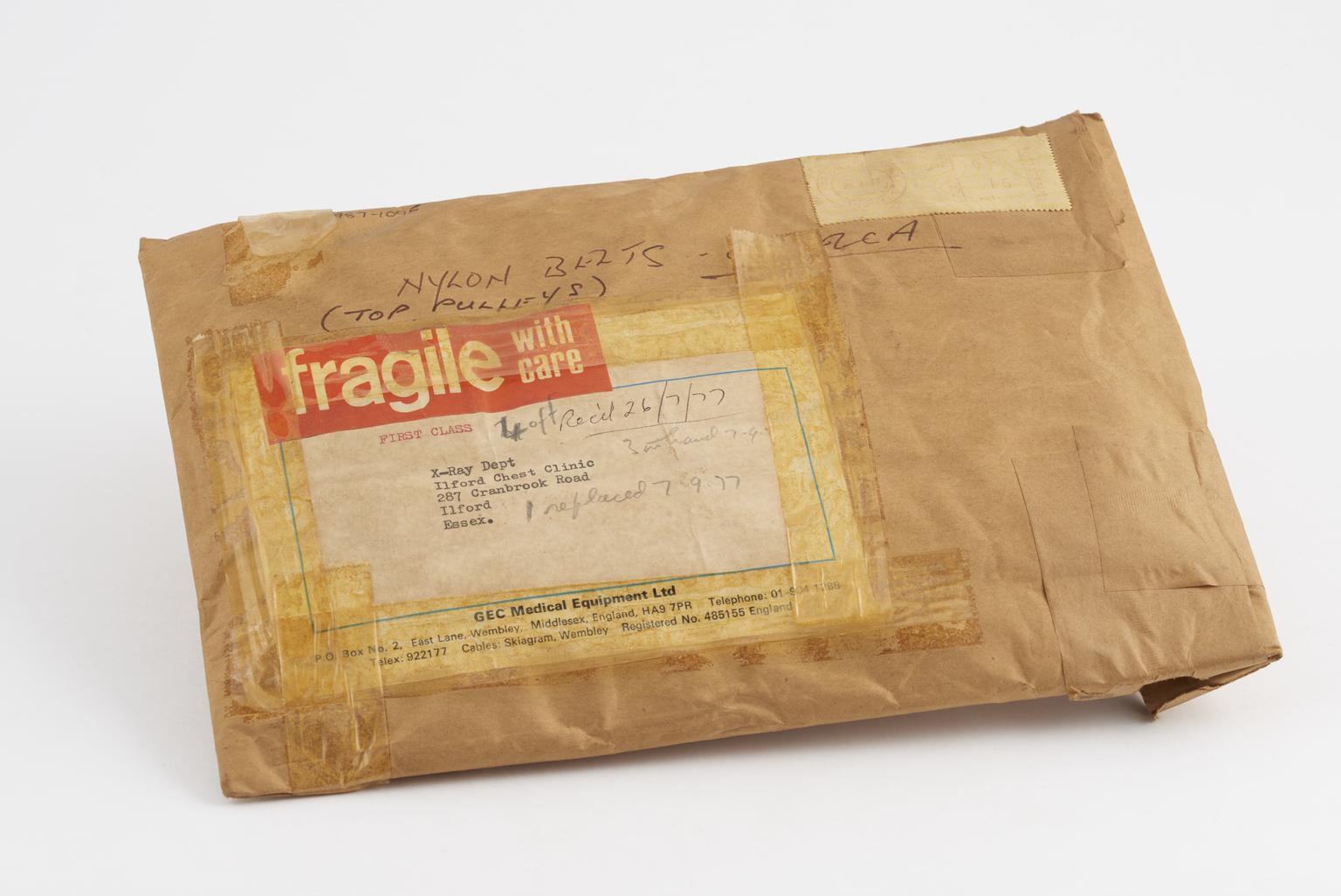 Envelope containing nylon belts and top pulleys, part of mass miniature ...