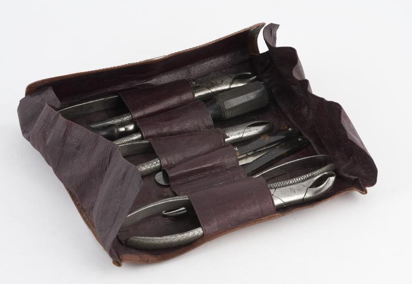 Dental extraction set, nine instruments in leather roll