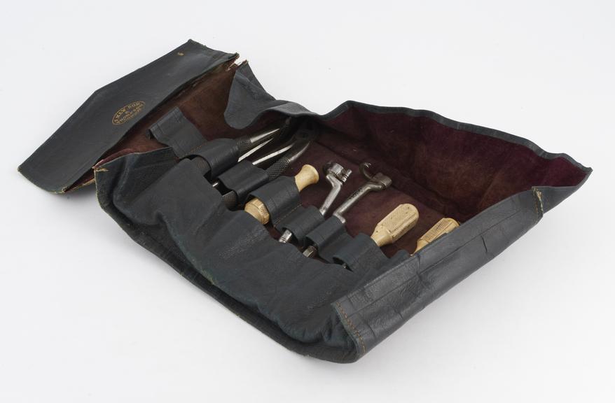 Dental extraction sets, incomplete, in leather roll, by S