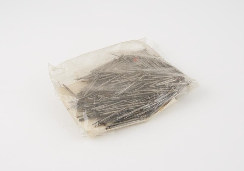 Large selection of small dental instruments, including burs