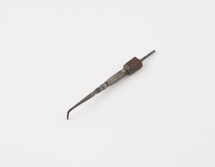 Dental stopper, steel with brown marble handle, mostly missing