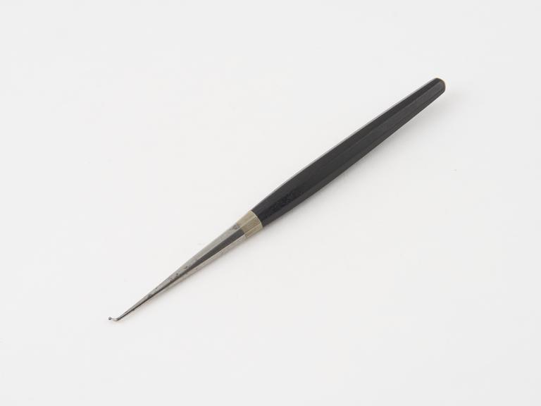 Dental plastics instrument, steel with ebony handle