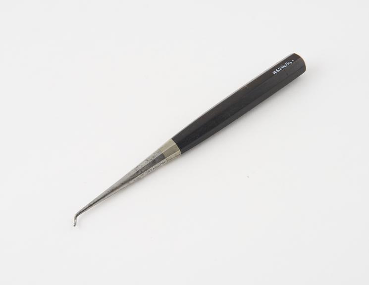 Dental stopper, steel with ebony handle, by W. and J