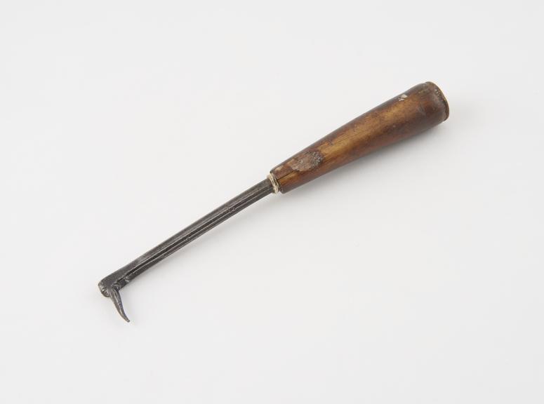 Dental stopper(?), steel with wooden handle, crude, Europe