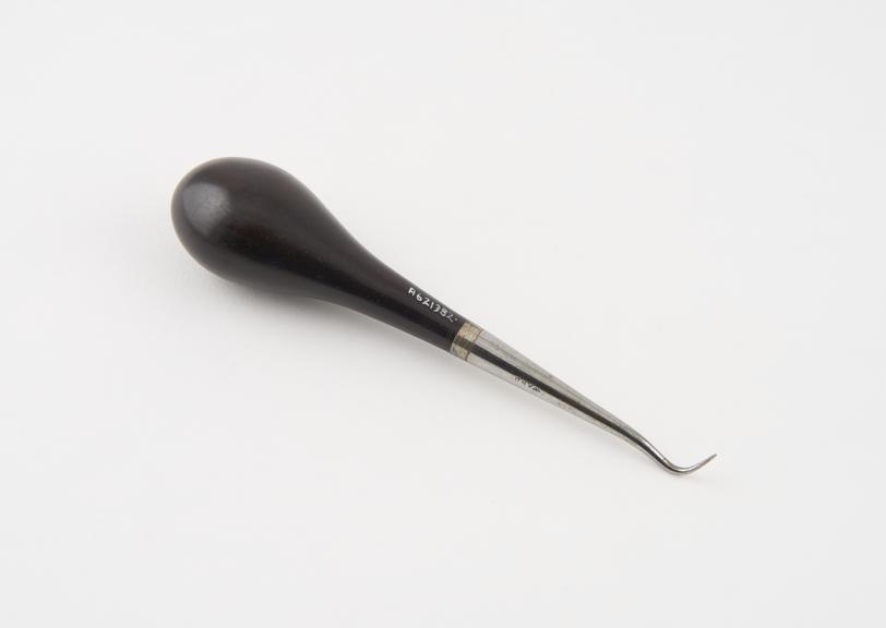 Dental stopper, steel with wooden handle, by Ward, England