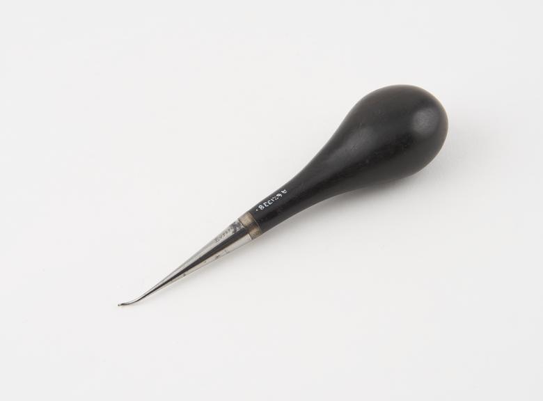 Dental stopper, steel with wooden handle, by Eurard, London