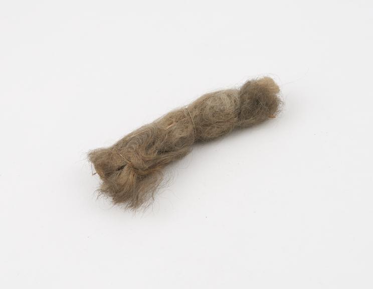 Wad, wool, probably used for cleaning teeth, no provenance