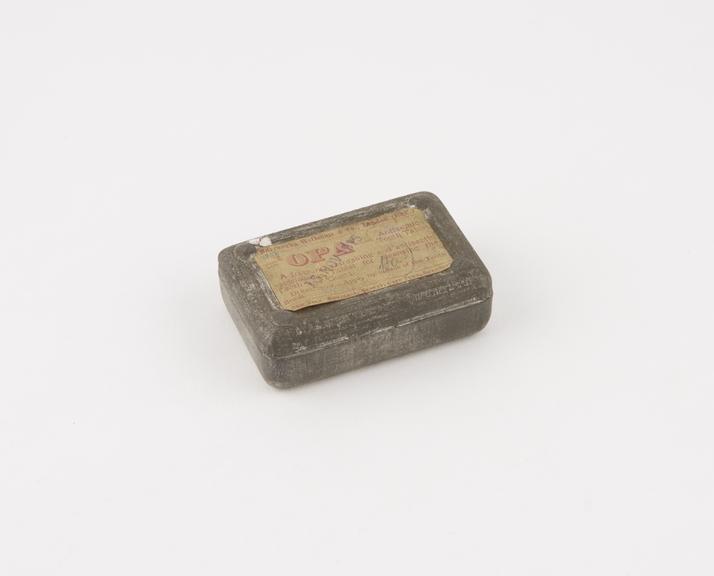 Metal tin containing one OPA antiseptic tooth tablet