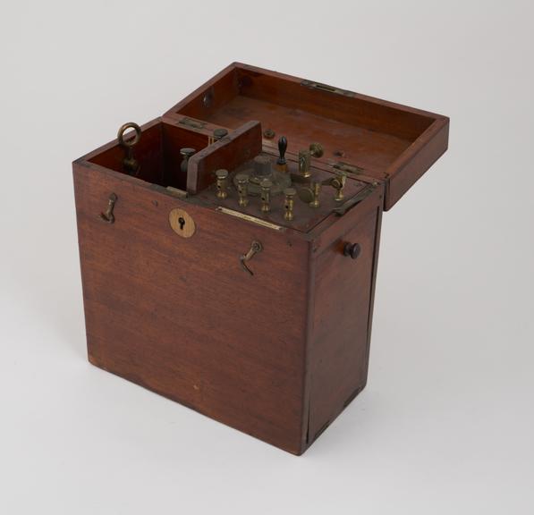 Rectangular wooden box containing upright coil, trembler