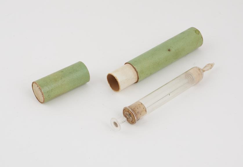 Glass piston-action syringe, in cardboard case