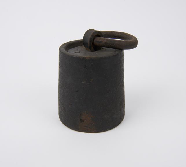 English iron weight with ring in loop, cylindrical, 19th century