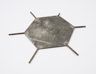 Metal plate representing a DNA base