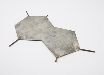 Metal plate representing a DNA base