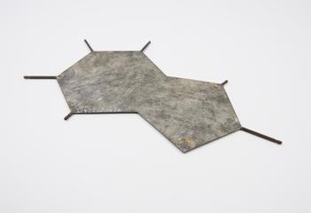 Metal plate representing a DNA base