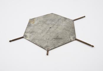 Metal plate representing a pyrimidine base. Used in the original Crick and Watson DNA model