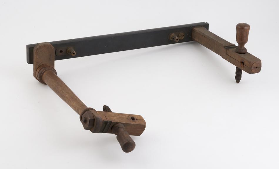 Bracket with two clamps on arms, both with tension keys