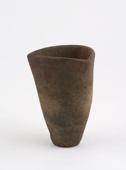 Unglazed earthenware crucible with circular base and triangular