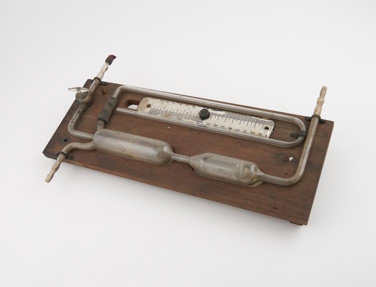 Manometer of glass and mercury, mounted on wooden board