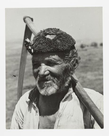 Farmer with scythe