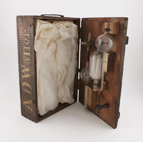 CO2 absorption apparatus, glass, in crude wooden case