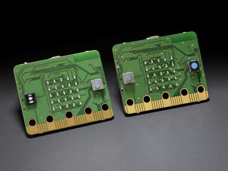 Two BBC micro:bits with plain green PCB finish