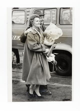 Photograph of Helen and Peter Kroger boarding a plane