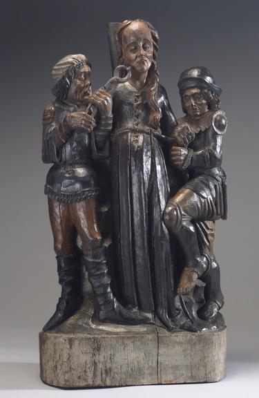 Wooden figure of Saint Apollonia and two torturers