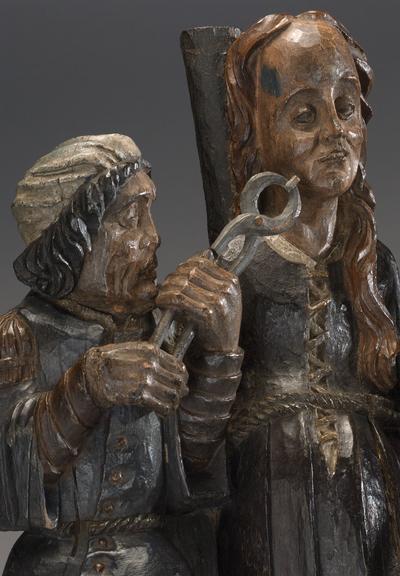 Wooden figure of Saint Apollonia and two torturers