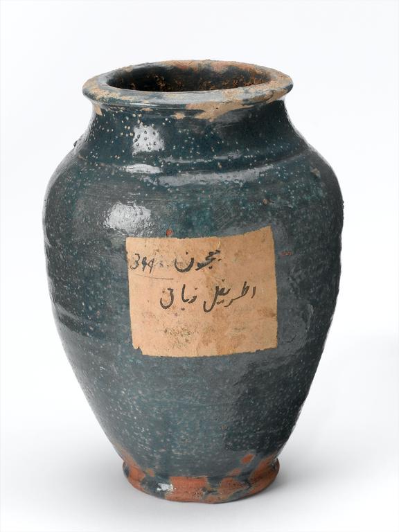 Blue glazed earthenware jar, with pitted surface