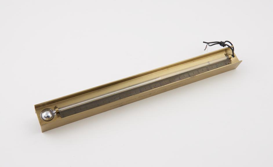 Mercury-in-glass thermometer in sturdy brass surro