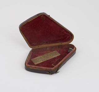 Leatherette case for spring fleam