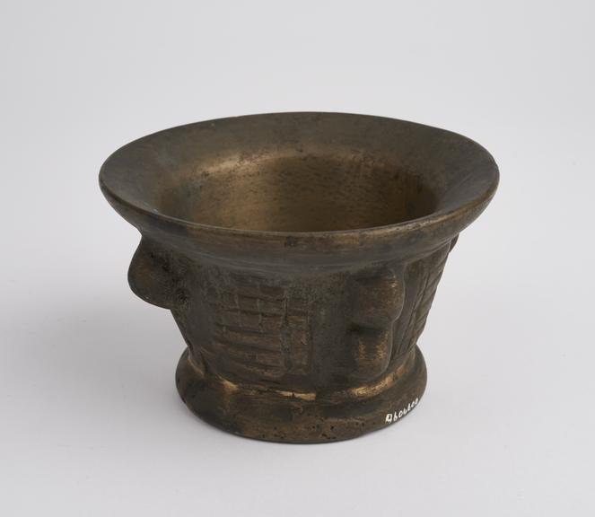 Small and squat bronze mortar, wide flared rim, fl