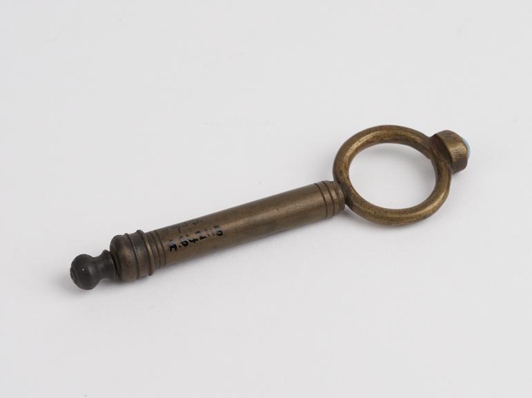 Brass or bronze finger ring and syringe combined