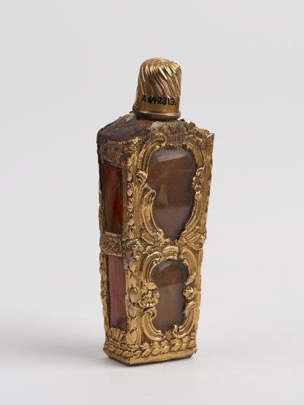 Silver gilt perfume bottle, set with orange-colour