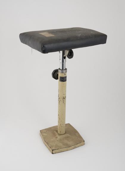 Foot rest, tilting and height adjustable, by C.J. Plucknett