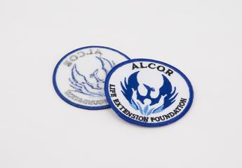 Two cloth patches supplied by Alcor Life Extension Foundation