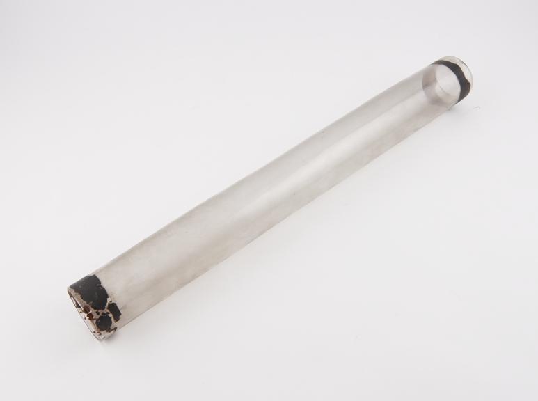 Open-ended clear glass tube with black tape both e