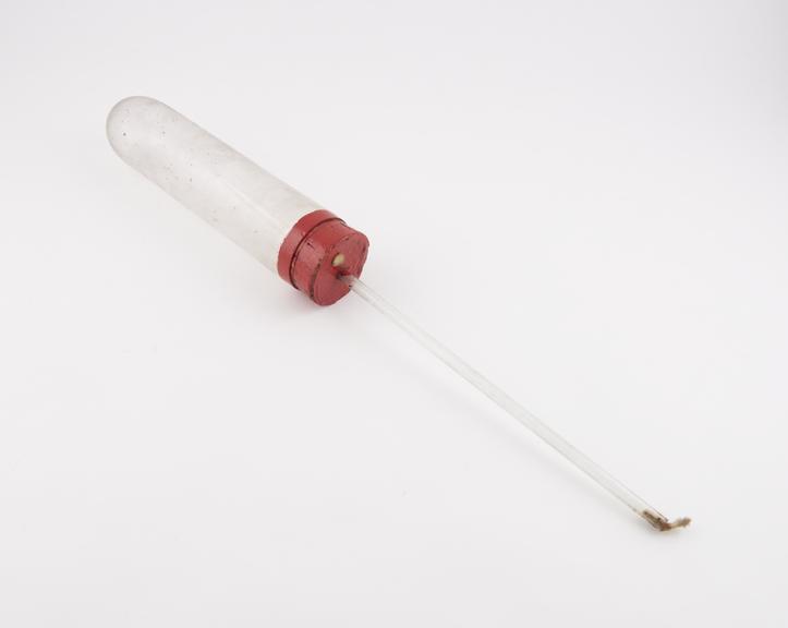 Clear glass test tube with rim painted and red cor