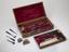 Set of surgical instruments in walnut case, by Savigny