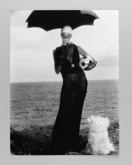 Photographic print of Clare on the beach with an umbrella