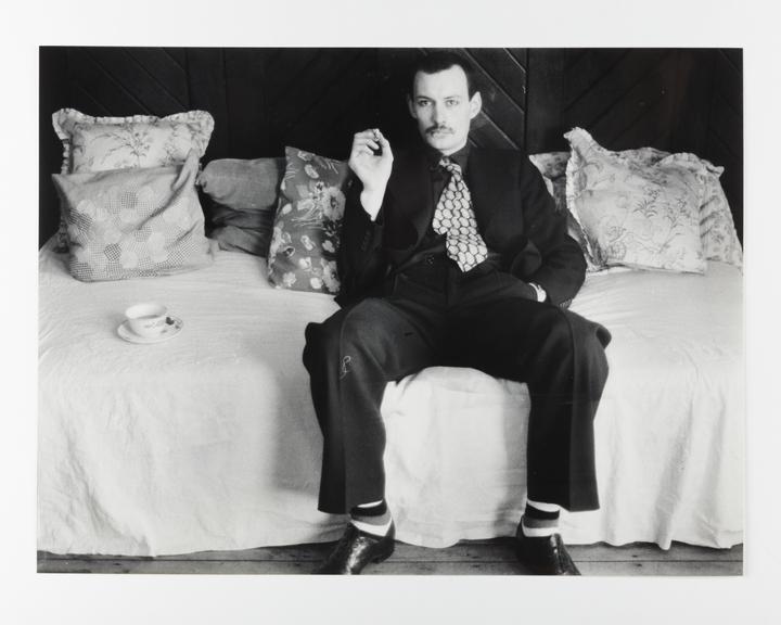 Photographic print of a man sat on a sofa