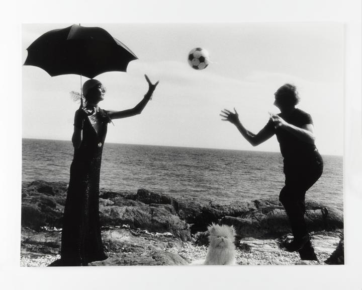 Photographic print of Clare and Kerry throwing a football back and forth