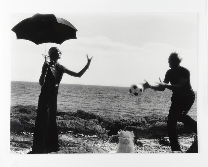 Photographic print of Clare and Kerry throwing a football back and forth