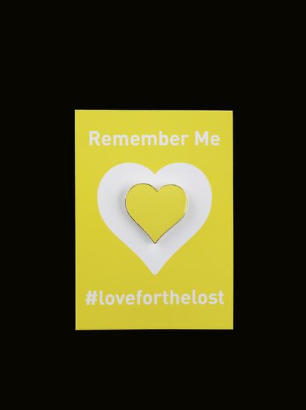Enamel lapel pin badge in the shape of a yellow heart