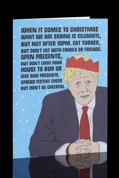 Christmas card on a blue background with a cartoon image of UK