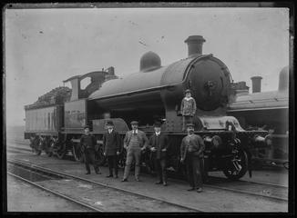 Railway staff at Bescot Engine Shed including Sidney Stainton stood on engine