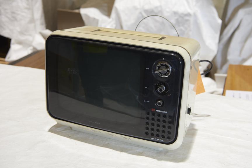 Hitachi Model F54G311 14" portable monochrome television receiver in white plastic case with sun filter