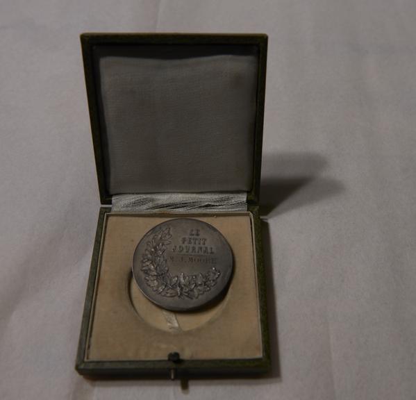 Silver-Coloured Circular Metal Medal, in Green Square Case, Won by James Moore