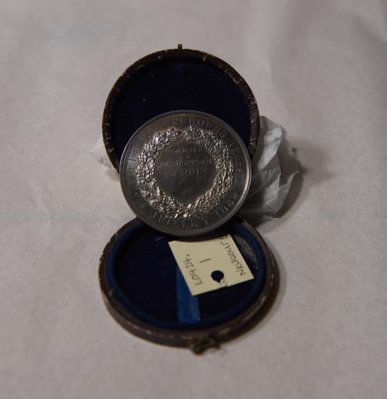 Silver-Coloured Circular Metal Medal, in Blue Circular Case, Won by James Moore