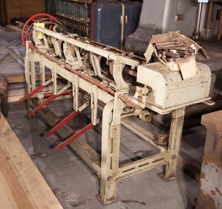 Part of transversing section of smallware warping machine. Made by William Hurst and Co